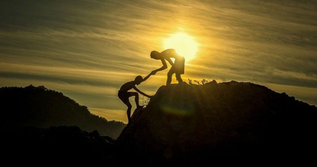 Picture showing successful problem solvers climbing a mountain utilizing the power to do something different