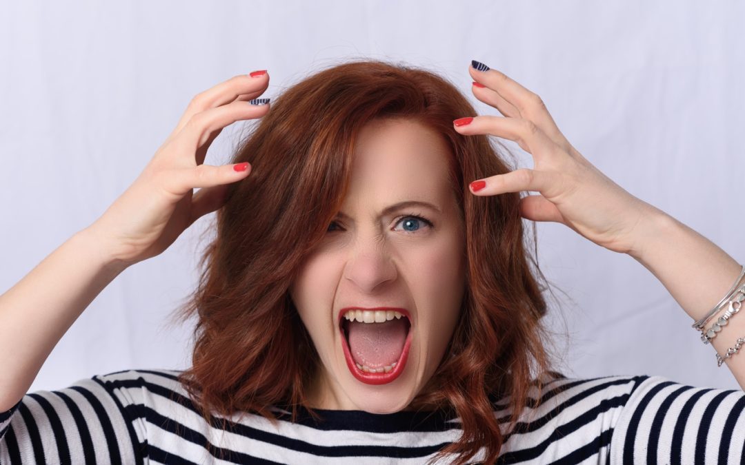 Picture of red haired woman experiencing hustle culture