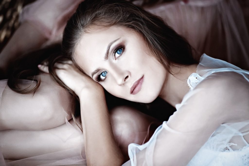 Girl with striking blue eyes expressing how to be vulnerable