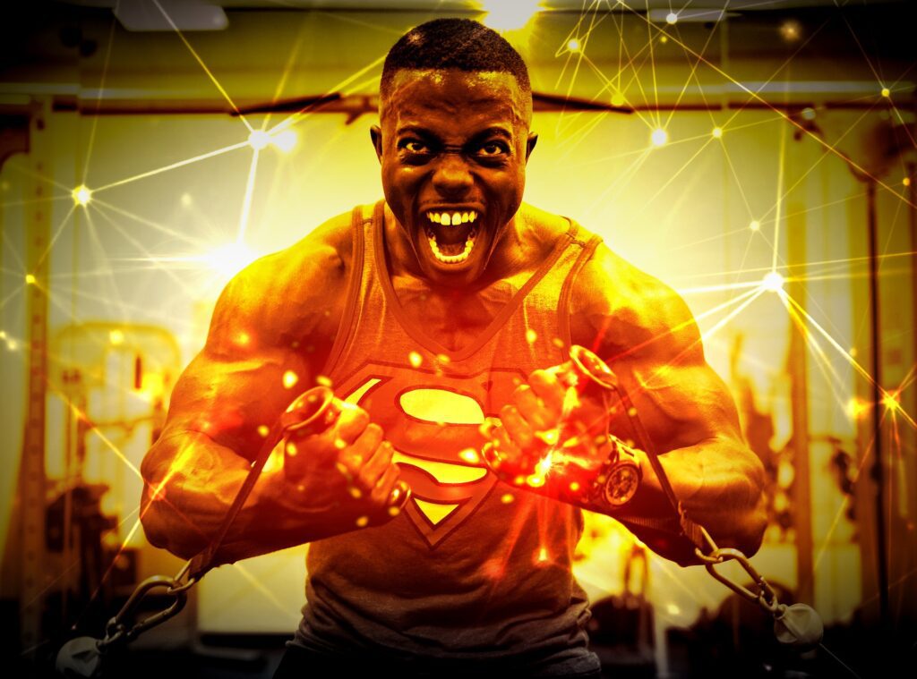 Black man lifting with superman coming out of his chest who aims to finish the year strong