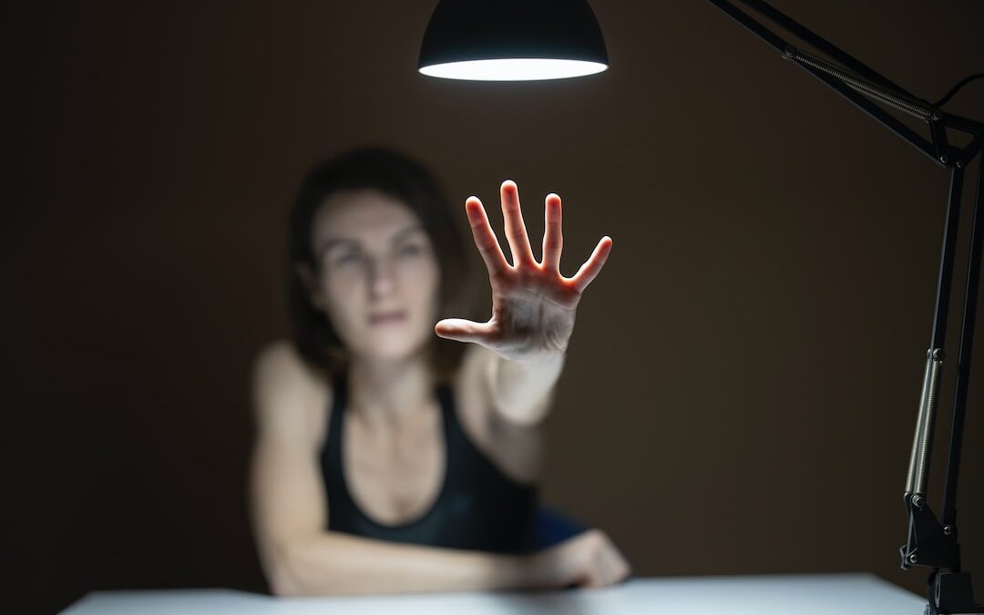 Woman reaching out to grasp her psychological immune system