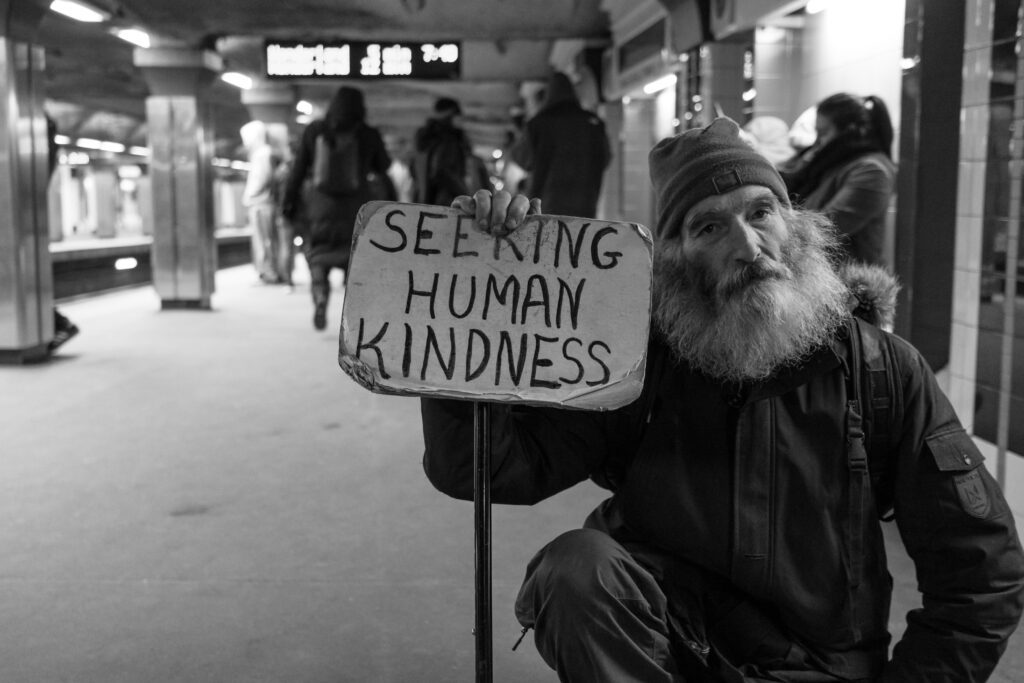 homeless man Seeking human acts of kindness photo