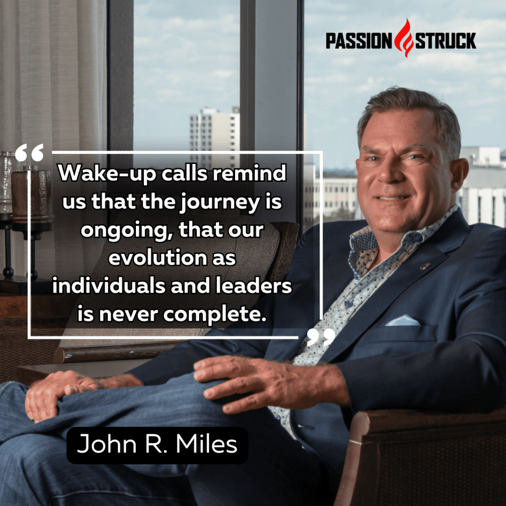 John R. Miles quote that wake-up calls remind us that the journey is ongoing, that our evolution as individuals and leaders is never complete