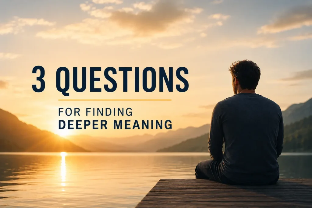 A contemplative figure sits on a wooden dock overlooking a calm mountain lake at sunrise, symbolizing reflection, presence, and the journey toward finding deeper meaning in life. The image includes the title “3 Questions for Finding Deeper Meaning” in bold, minimalist typography against a serene natural landscape.